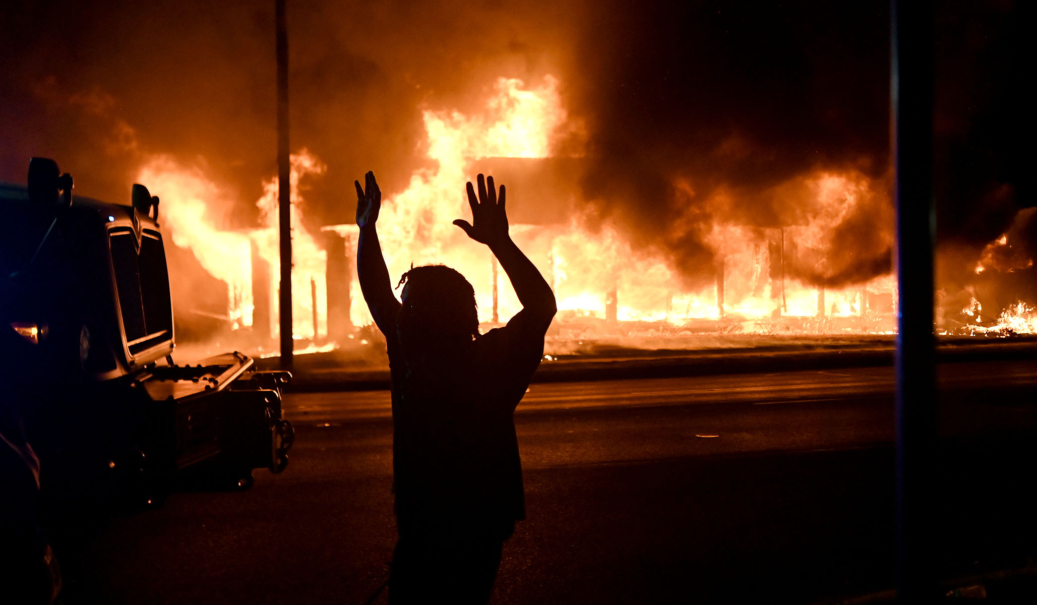 People protest after a Black man identified as Jacob Blake was shot several times by police in Kenosha